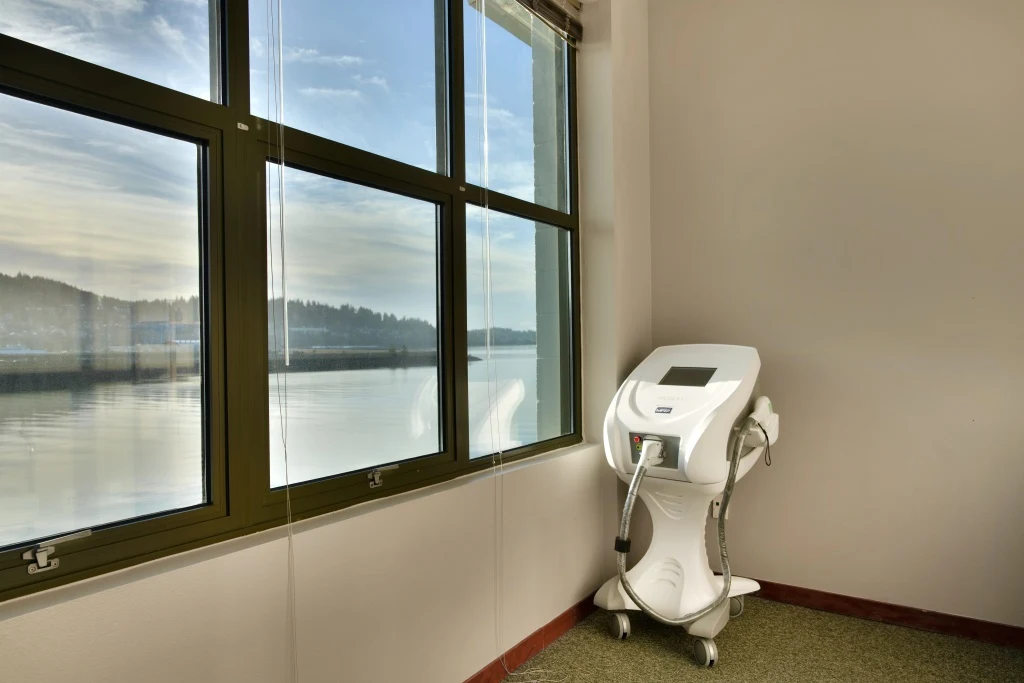 Laser treatment equipment beside the windows overlooking Bellingham Bay